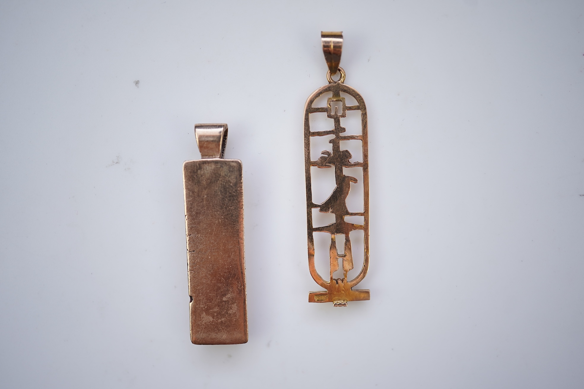 Two gold pendants